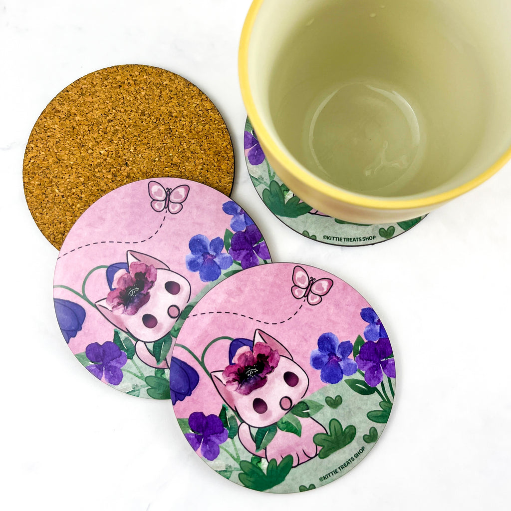 Cute purple coasters featuring a kitty looking up at a butterfly